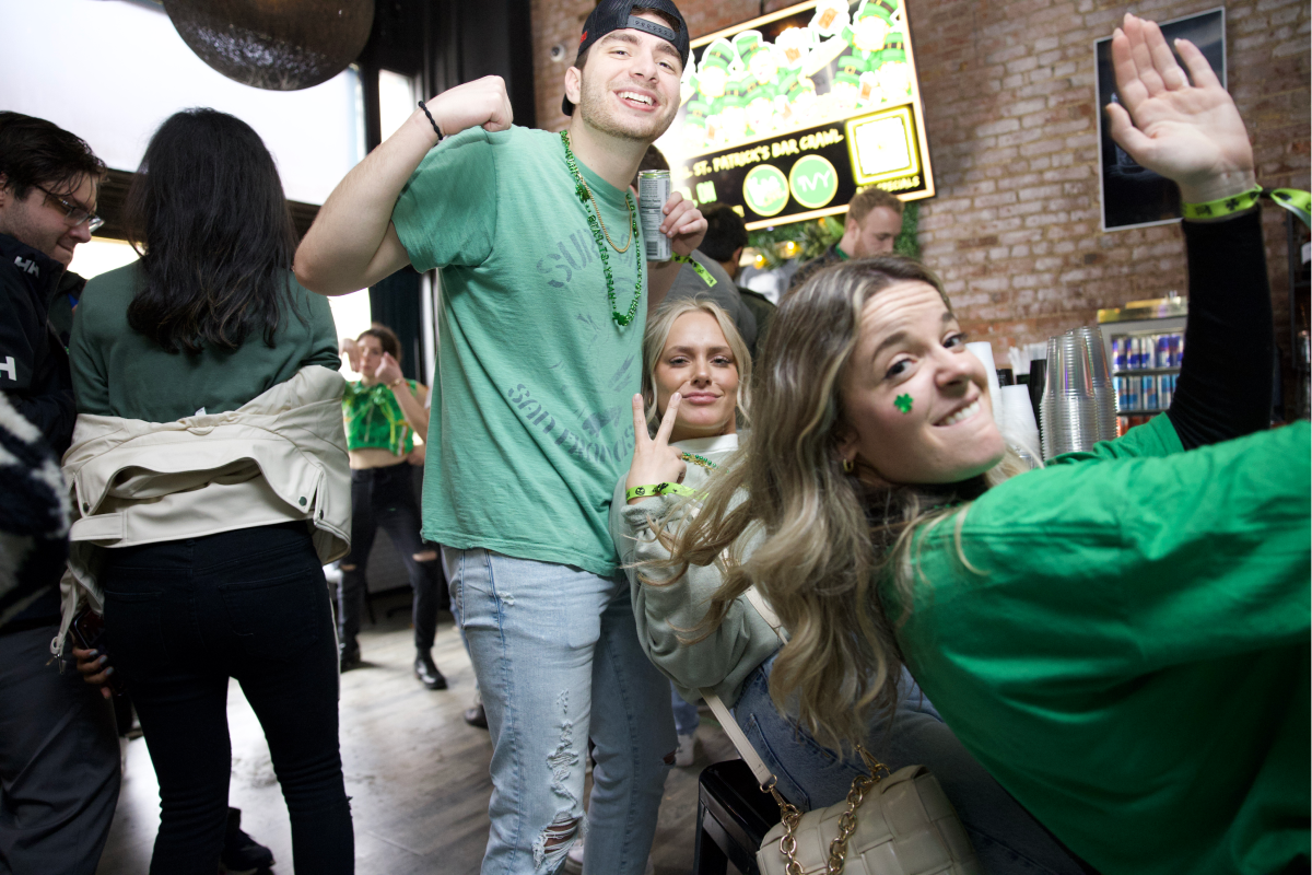 friends having a good time at a st patricks bar crawl in cleveland on st patricks day