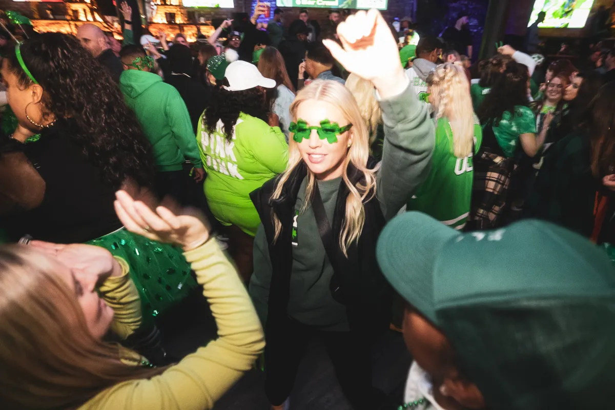 girl dancing - celebrating st. patrick’s day in chicago