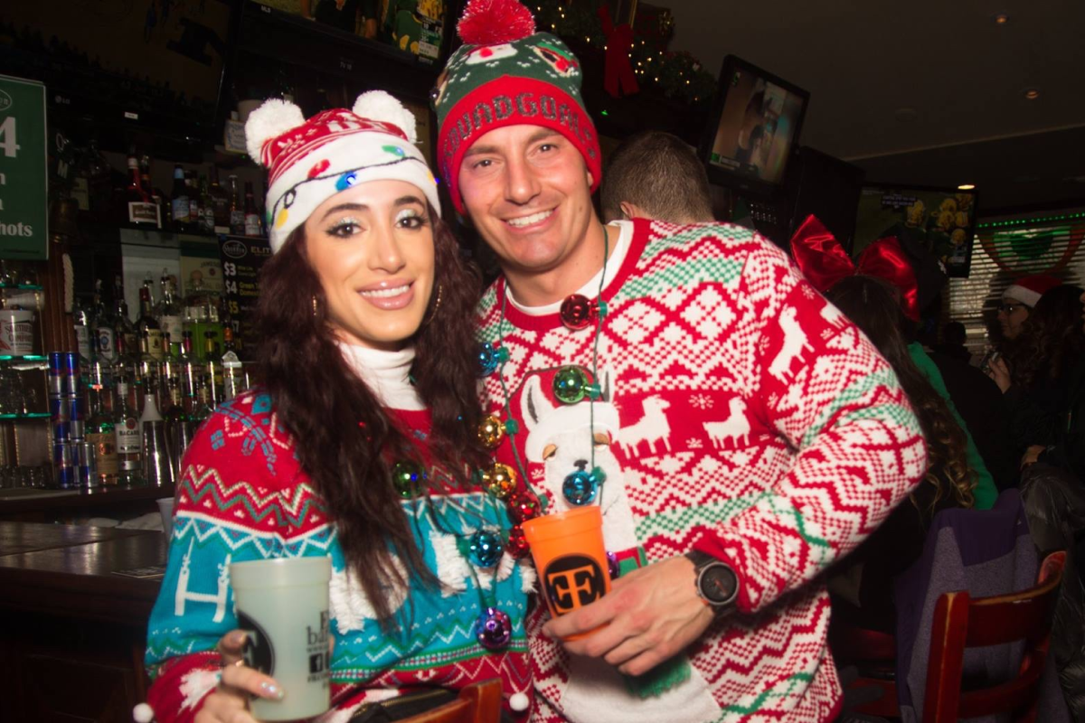 bad santas in action at the ugly sweater bar crawls