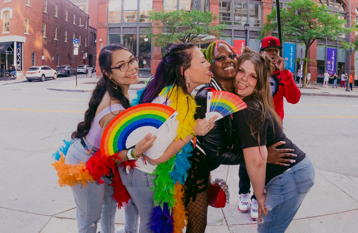 Friends dressed in rainbow gear celebrating pride month 