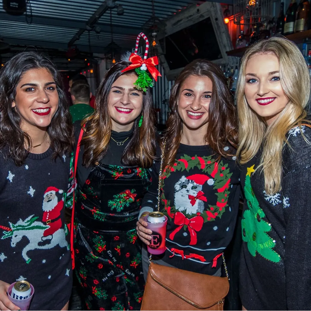 4 Girls in ugly sweaters at the Pittsburgh ugly sweater christmas crawl