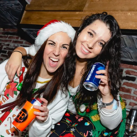 Tis the season to bar hop in style: Ugly sweater crew lighting up the night.