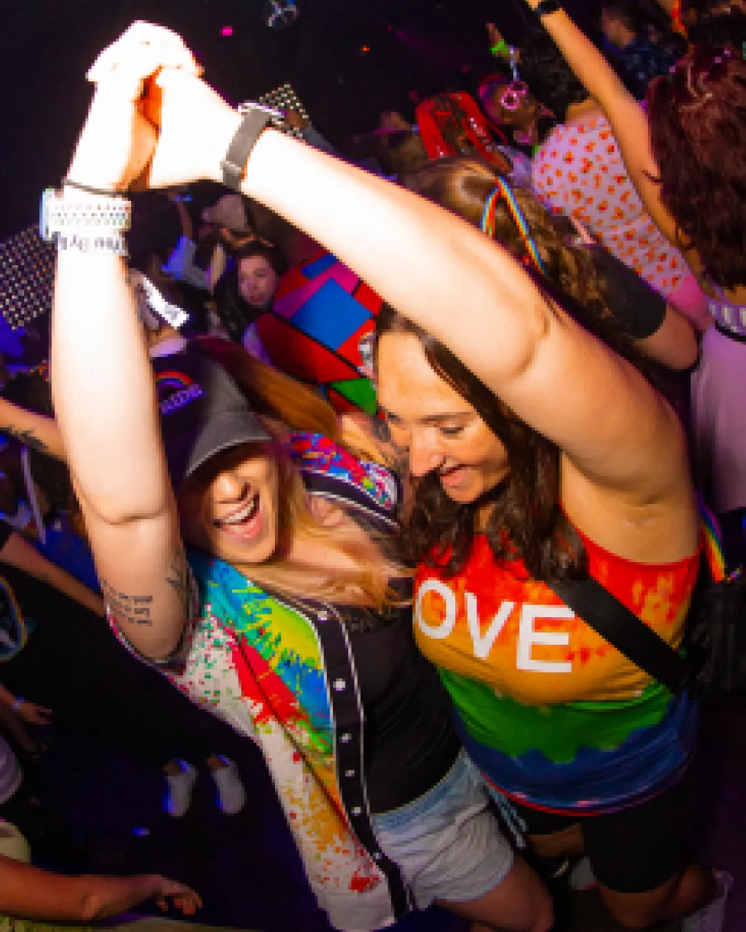 2 lovebirds showing their energy dancing together having a blast at the Pride Bar Crawl
