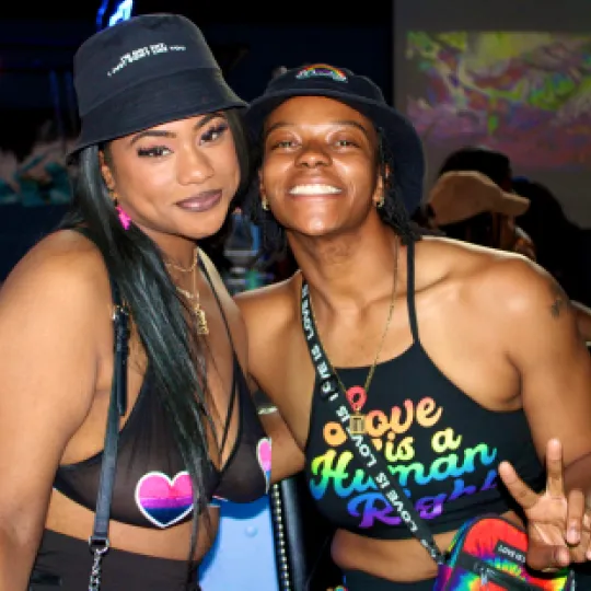 Bar lights, flirty nights, and 2 friends that makes the Pride Bar Crawl oh-so-right