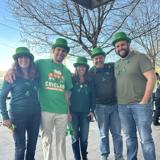 A group of friends gather outside of check-in for the St Patricks Bar Crawl in Charlotte