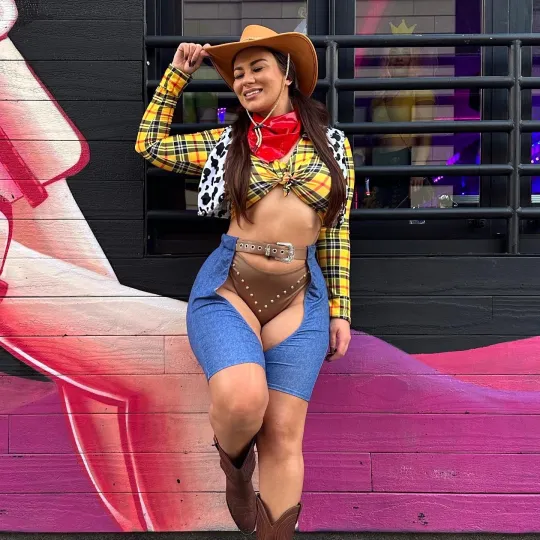 The winner of last year's Halloween Bar Crawl Photo Contest shows off her Toy Story Themed costume outside some of the best bars in Chicago