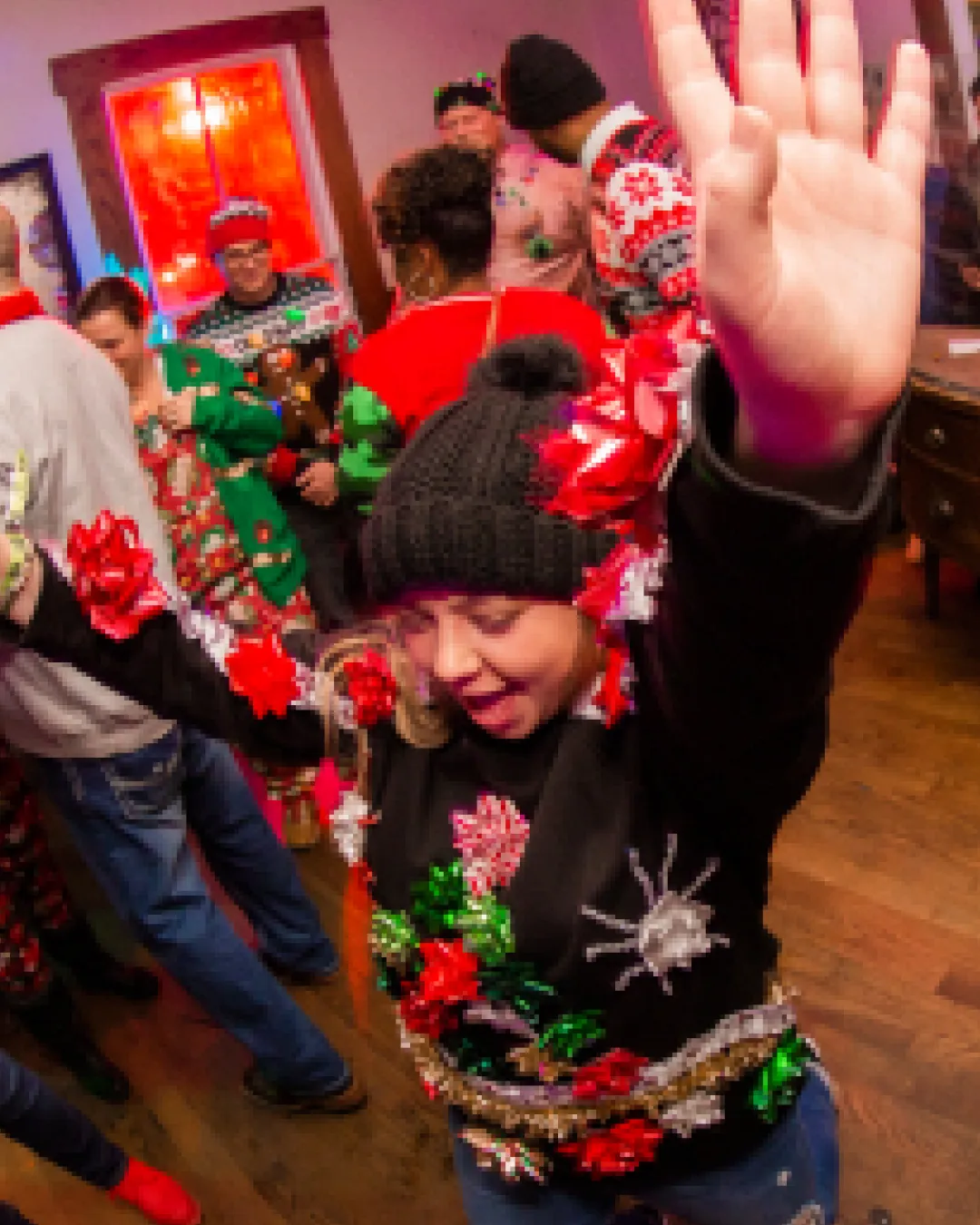 Merry and bright: festive folks rocking ugly sweaters at the bar crawl!