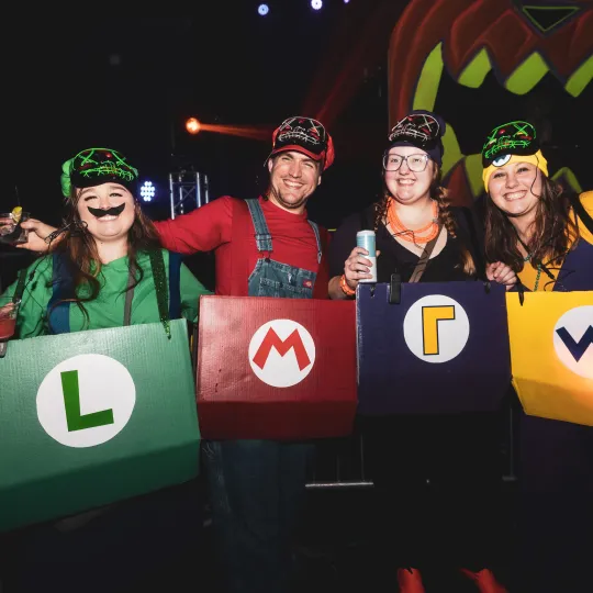 4 bar crawling friends show off their mario cart Halloween costumes at the Halloween Bar Crawl in Cleveland