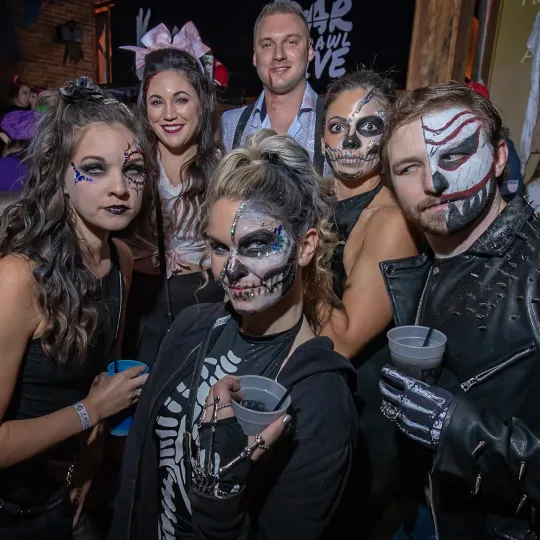 A group of skeleton besties show off their most spooky looks during th Halloween Bar Crawl in Cle