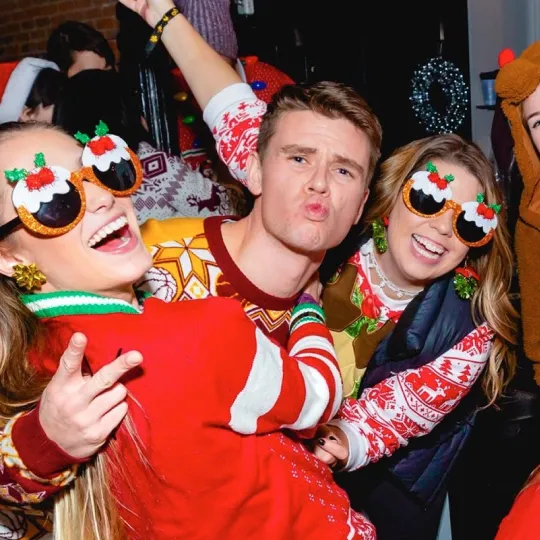 All is merry and slightly bizarre with these ugly sweater bar crawl champs!