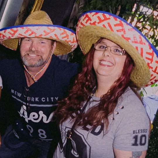 Guy and girl wearing sombrero hats at the tacos and tequila bar crawl