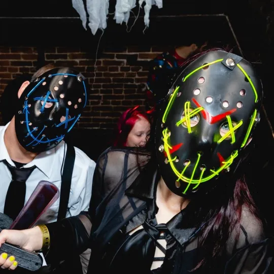 Bar Crawlers show off their LED light up face masks during the Halloween Bar Crawl in Pittsburgh