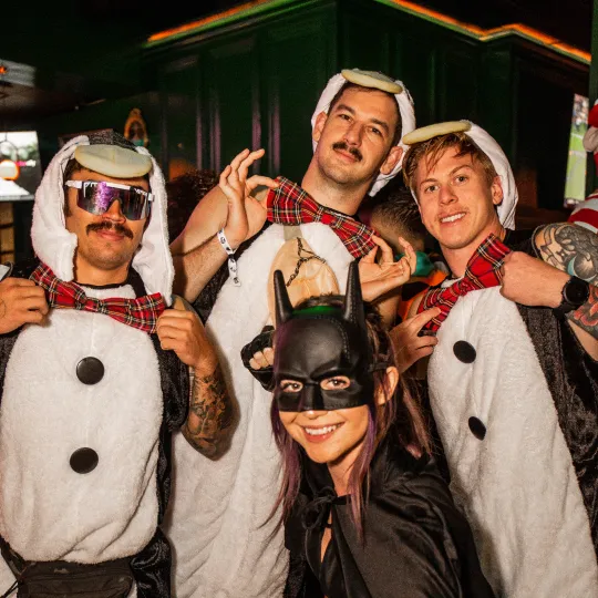 Under the spell of the night, a band of buddies, unified by their love for Halloween, showcase an array of costumes that resonate with creativity and camaraderie during the Halloween Bar Crawl

