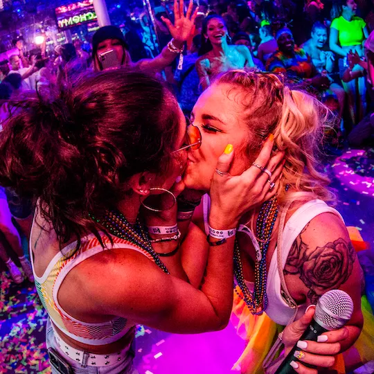 Love at last! Lesbian couple kiss as a proposal just happened on the dance floor at the Pride Bar Crawl in Raleigh