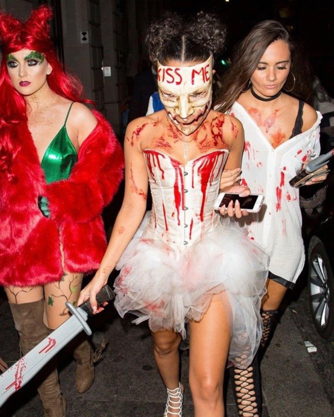 3 girls dressed up for a Halloween bar crawl in Halloween costumes
